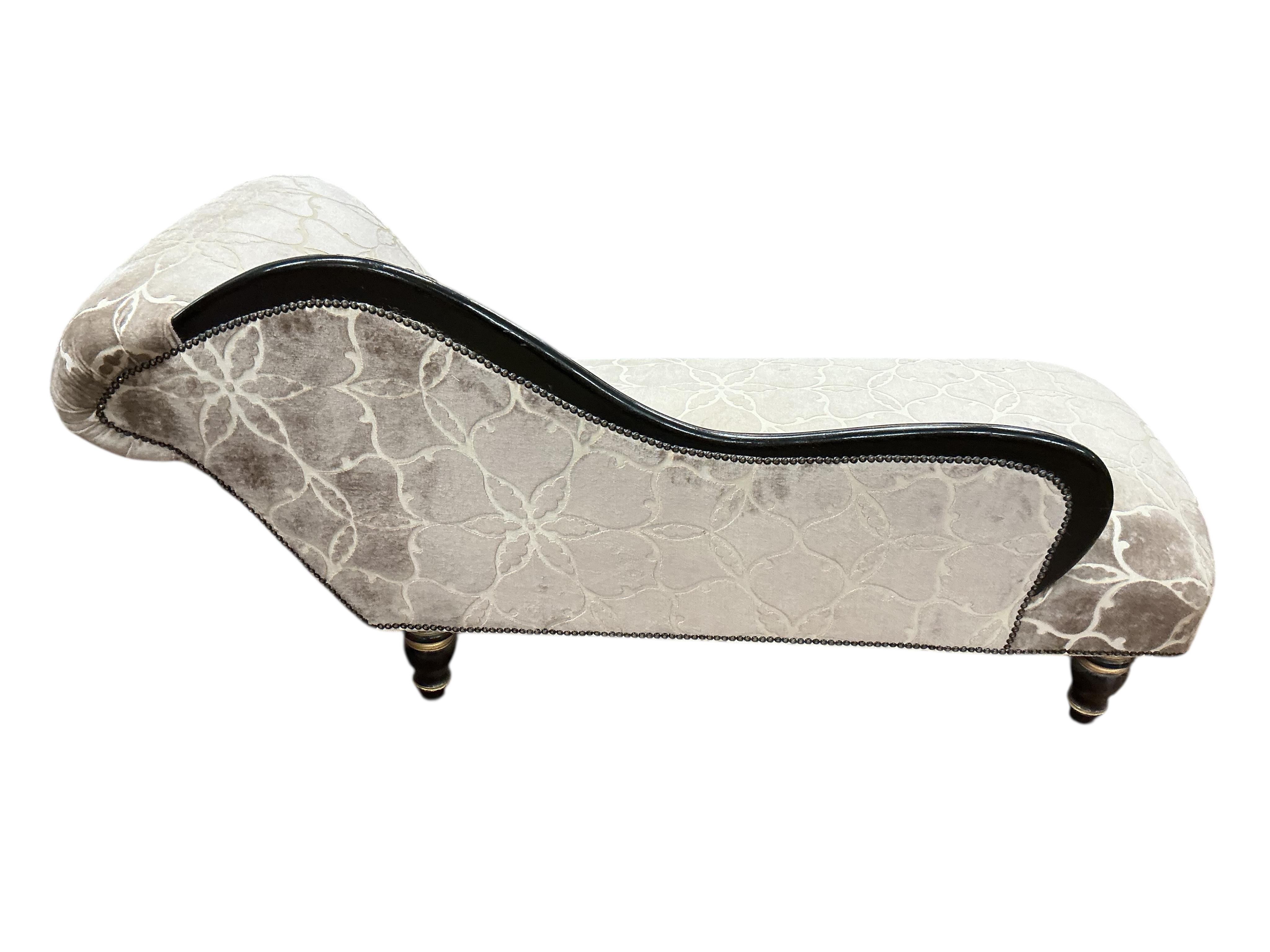 A Victorian upholstered chaise longue, later painted, length 150cm, depth 64cm, height 76cm